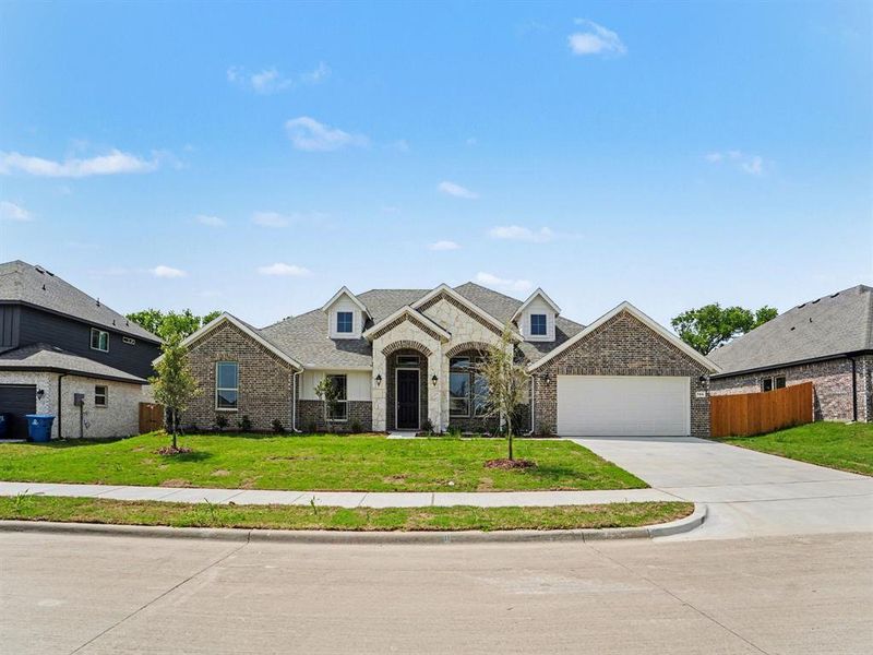 Front exterior of a new home in Cole Crossing Estates, DeSoto, TX, highlighting curb appeal (Image 21). Front exterior of a new home in Cole Crossing Estates, DeSoto, TX, highlighting curb appeal (Image 21).