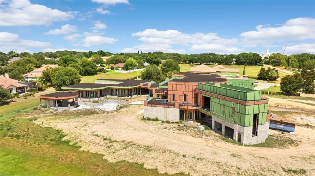 Front exterior of a new home in , Windermere, FL, highlighting curb appeal (Image 1).
