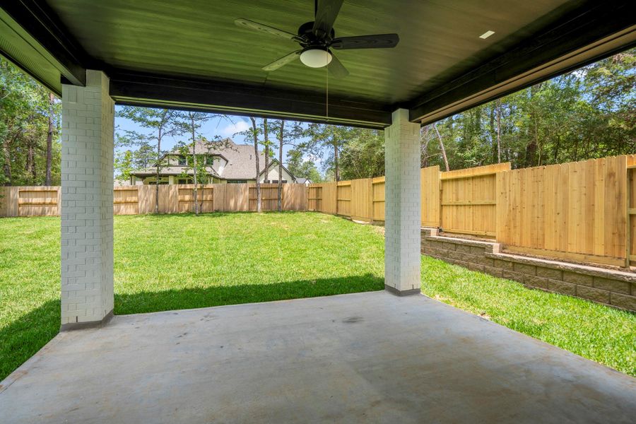 Exterior details and patio area of a home in The Woodlands Hills, Willis (Image 31). Exterior details and patio area of a home in The Woodlands Hills, Willis (Image 31).