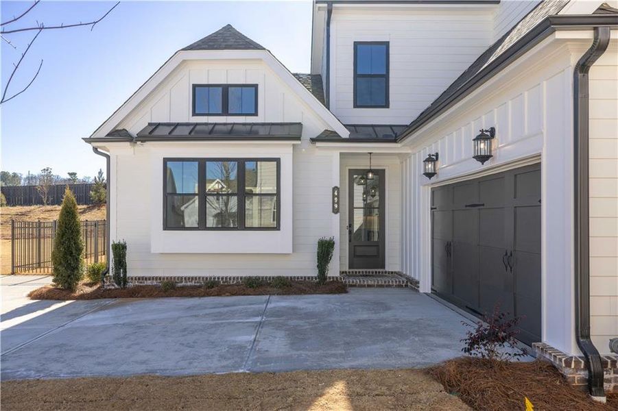 Exterior details and patio area of a home in Promenade at Sawnee Village, Cumming (Image 19).
