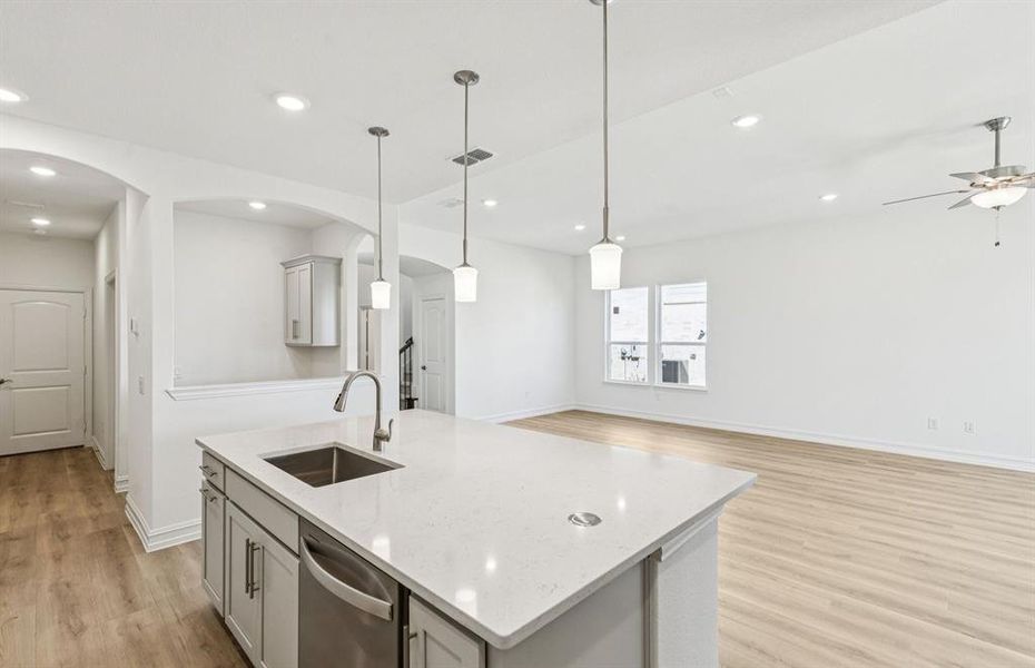 Large island overlooking gathering room and dining areas Large island overlooking gathering room and dining areas