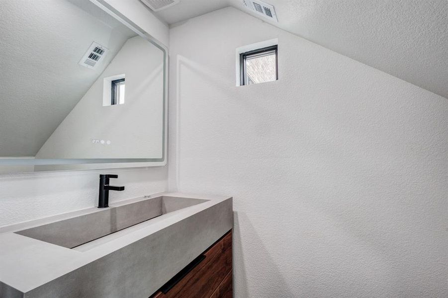 First level half bathroom. First level half bathroom.