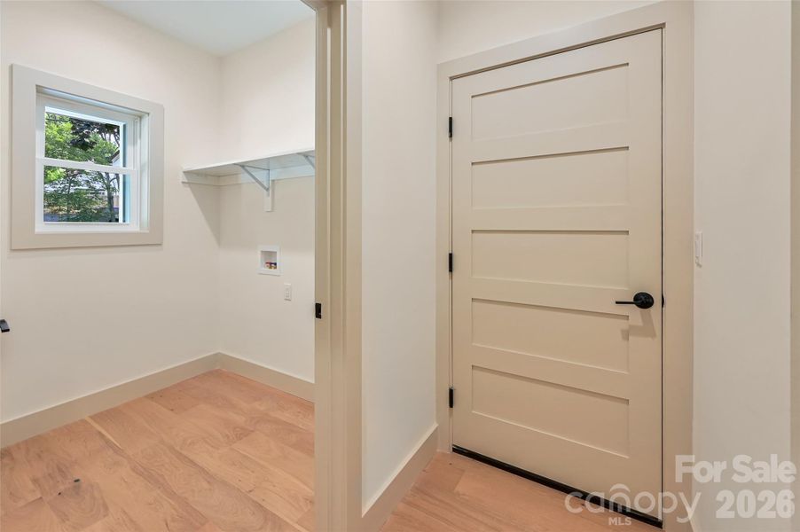 Main level laundry and door to garage