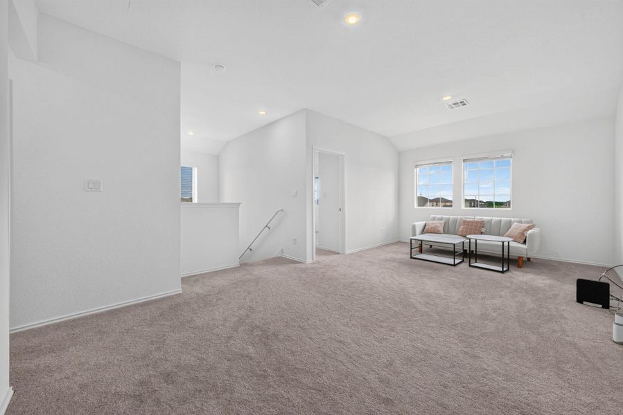 A versatile open loft area provides ample space for relaxation or recreation. A versatile open loft area provides ample space for relaxation or recreation.