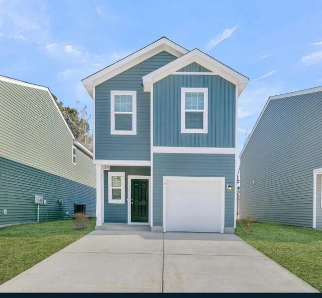 Front exterior of a new home in Pinckney Place, North Charleston, SC, highlighting curb appeal (Image 13).