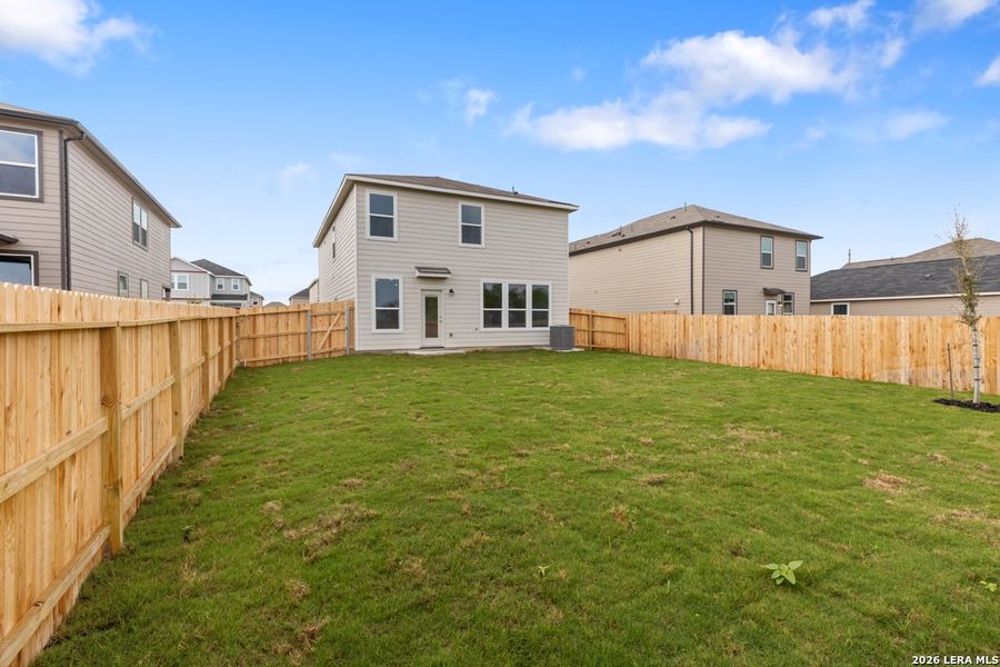 Exterior details and patio area of a home in Woodside Farms, Seguin (Image 20).