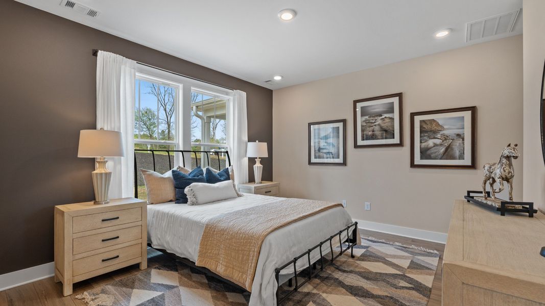 First-class hardwood floors and tasteful finishes elevate the private retreat of this exceptional primary suite