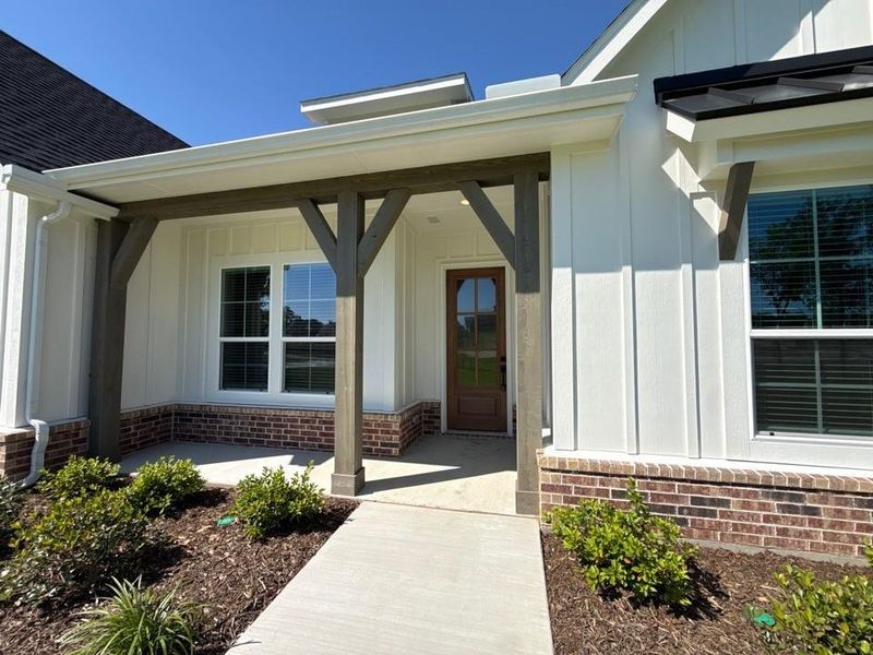 Exterior details and patio area of a home in Oak Grove Addition, Springtown (Image 3).