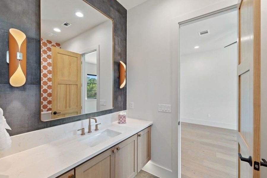 Beautifully appointed guest bath with designer-selected finishes. Beautifully appointed guest bath with designer-selected finishes.