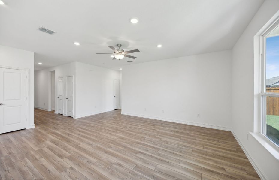 Sunbathed gathering room with expansive windows