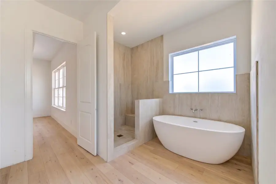 Virtual rendering of the spa-inspired primary bathroom at completion.