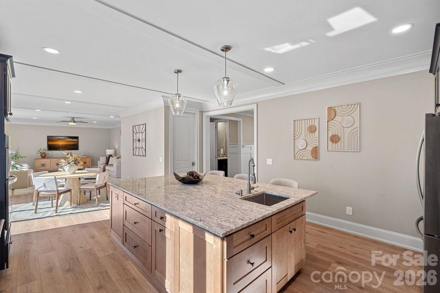 Designed for connection, the large center island with sink opens to the Breakfast Area and main living space, allowing the chef to be part of everyday living.