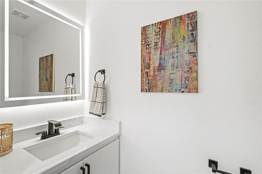 Bathroom featuring vanity and visible vents