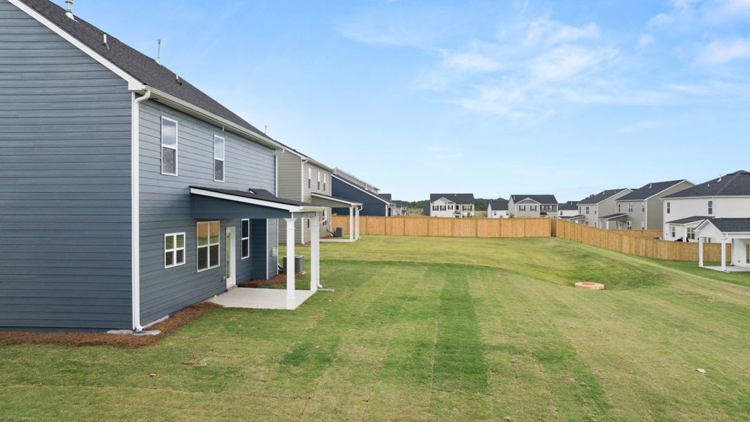 Exterior details and patio area of a home in Preserve at Dove Creek, Statham (Image 19).