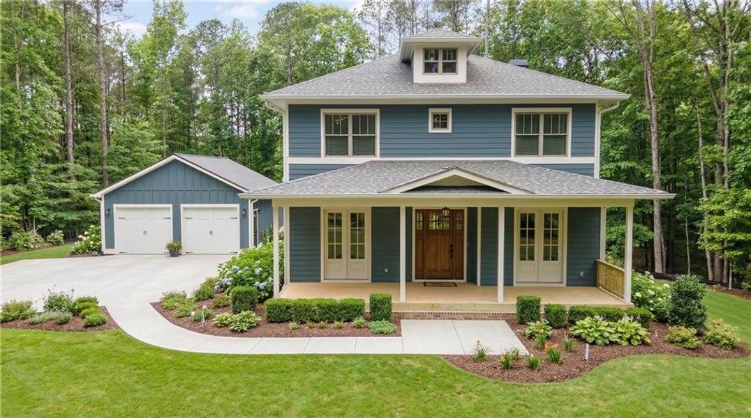 Front exterior of a new home in , Holly Springs, GA, highlighting curb appeal (Image 1). Front exterior of a new home in , Holly Springs, GA, highlighting curb appeal (Image 1).