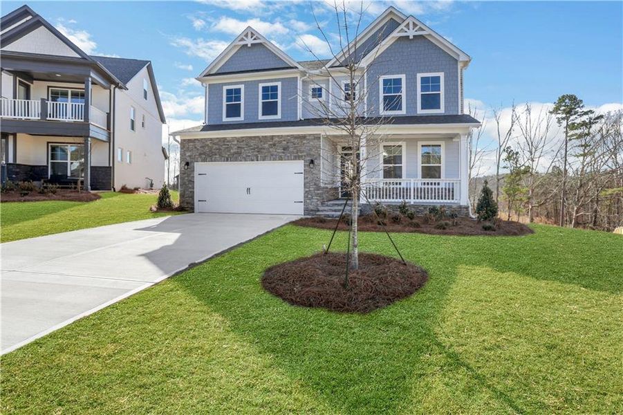 Front exterior of a new home in Cambridge, Flowery Branch, GA, highlighting curb appeal (Image 2).