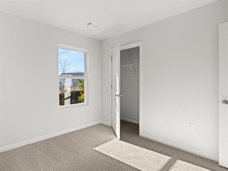 Spacious, unfurnished interior of a new home in Waypoint, Flowery Branch (Image 13).