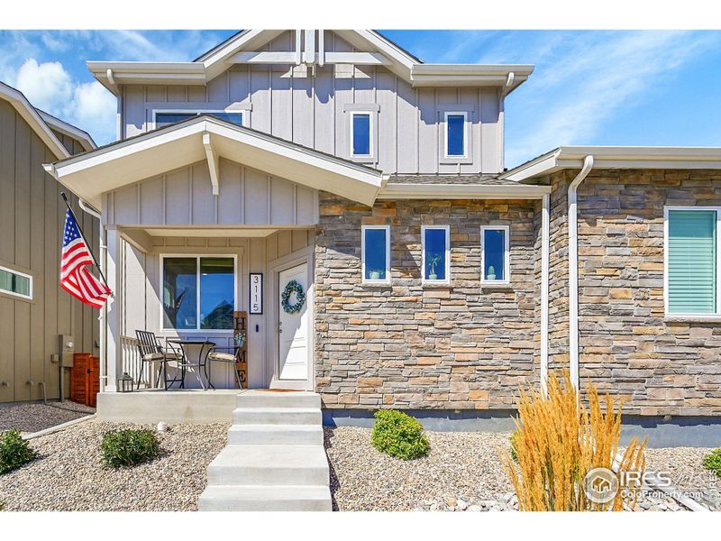 Front exterior of a new home in , Loveland, CO, highlighting curb appeal (Image 20).