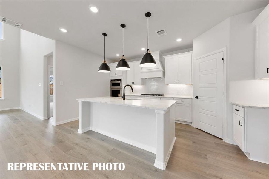 Featuring a spacious kitchen island that overlooks the family and dining rooms, the chef in the family will never be left out of the party in this dream kitchen! REPRESENTATIVE PHOTO Featuring a spacious kitchen island that overlooks the family and dining rooms, the chef in the family will never be left out of the party in this dream kitchen! REPRESENTATIVE PHOTO