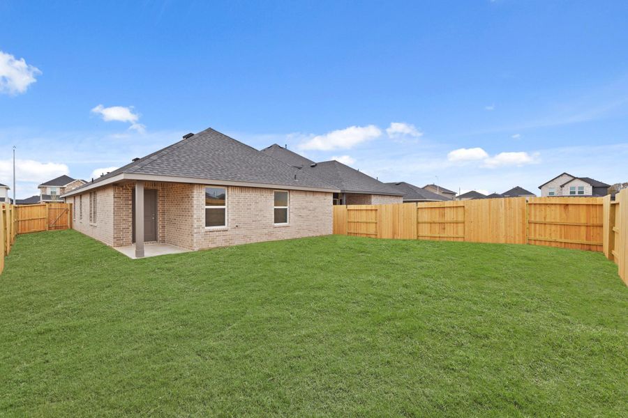 Exterior details and patio area of a home in Sunterra, Katy (Image 3).