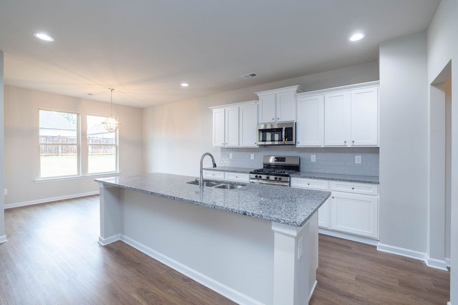 The breakfast area is located off of the kitchen