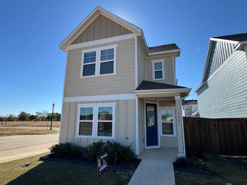 Front exterior of a new home in Black Hill Farm, Gainesville, TX, highlighting curb appeal (Image 1).