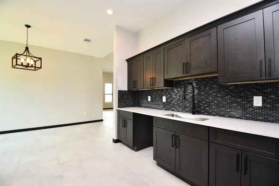 Kitchen has appealing backsplash and Cabinets / Counterspace galore Kitchen has appealing backsplash and Cabinets / Counterspace galore