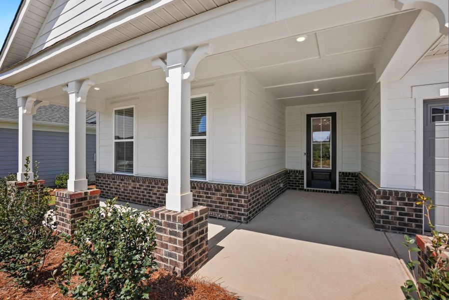 Exterior details and patio area of a home in Carolina Riverside, Belmont (Image 38).