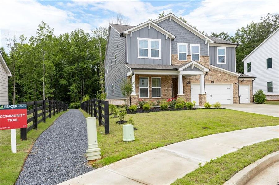 Front exterior of a new home in Hillside Manor, Powder Springs, GA, highlighting curb appeal (Image 29). Front exterior of a new home in Hillside Manor, Powder Springs, GA, highlighting curb appeal (Image 29).