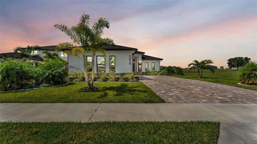 Front exterior of a new home in , Auburndale, FL, highlighting curb appeal (Image 2). Front exterior of a new home in , Auburndale, FL, highlighting curb appeal (Image 2).