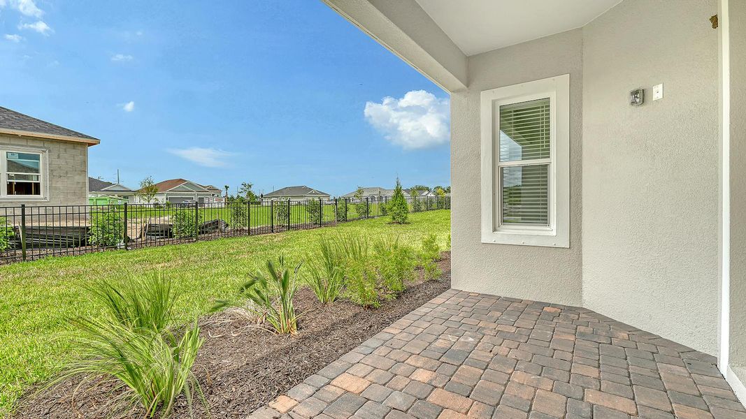 Exterior details and patio area of a home in Wildleaf Real Estate and Homes for Sale in Parrish, FL - Neal Communities, Parrish (Image 19).