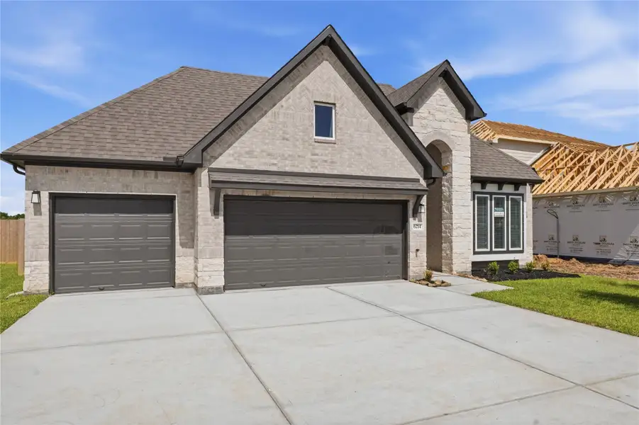Front exterior of a new home in Foxtail Palms, Manvel, TX, highlighting curb appeal (Image 21).