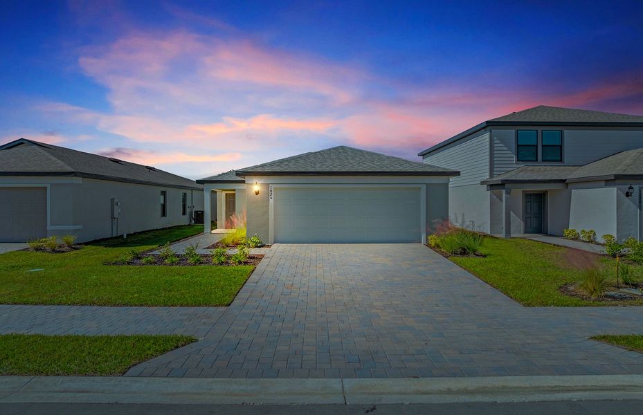 Front exterior of a new home in Caloosa Cove, Labelle, FL, highlighting curb appeal (Image 2).