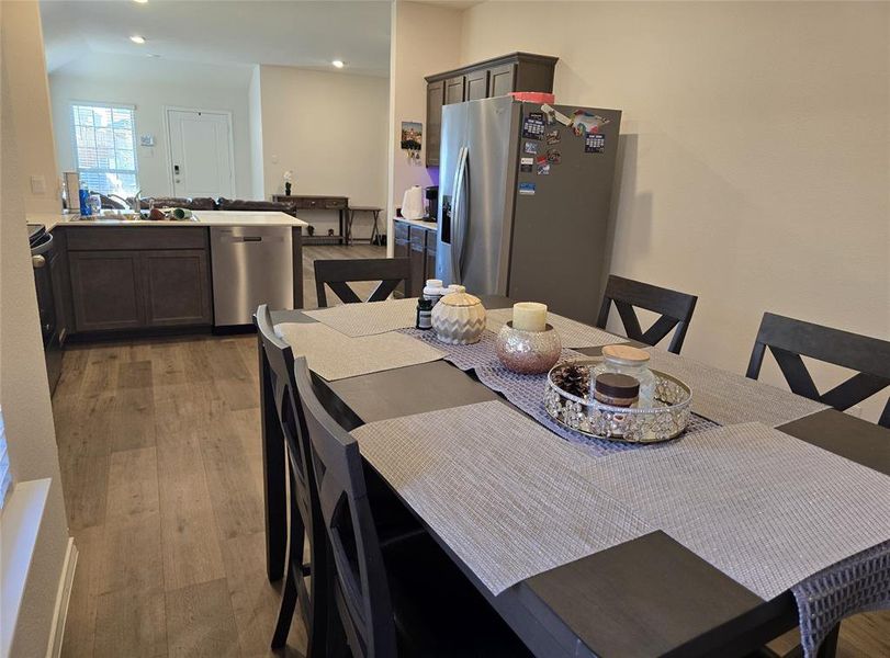 Dining area featuring light hardwood / wood-style flooring and sink