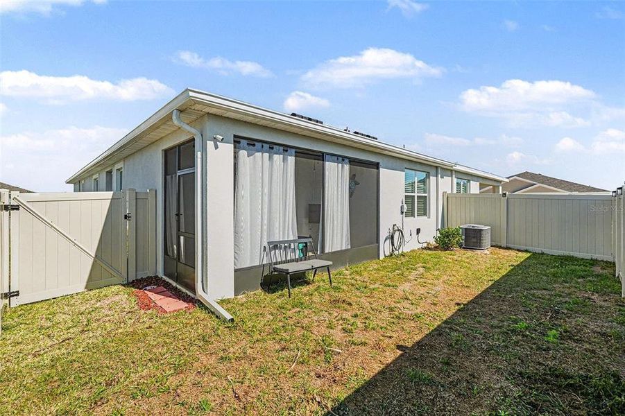Exterior details and patio area of a home in Woodcreek, Wesley Chapel (Image 24).