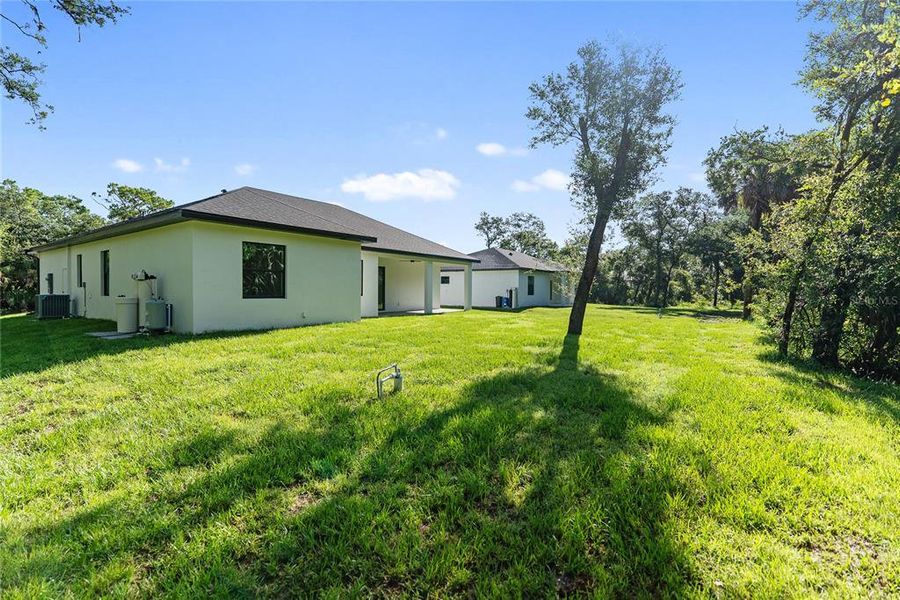 Front exterior of a new home in , Port Charlotte, FL, highlighting curb appeal (Image 34). Front exterior of a new home in , Port Charlotte, FL, highlighting curb appeal (Image 34).