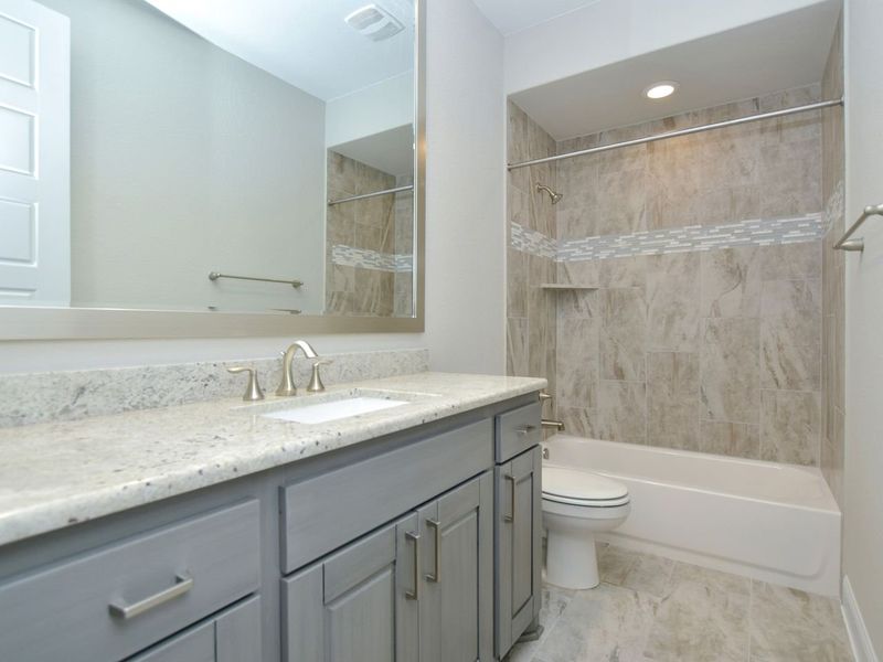 Representative furnished interior of a home built from the Madera II by Giddens Homes in Scofield Farms Estates, Georgetown (Image 180).