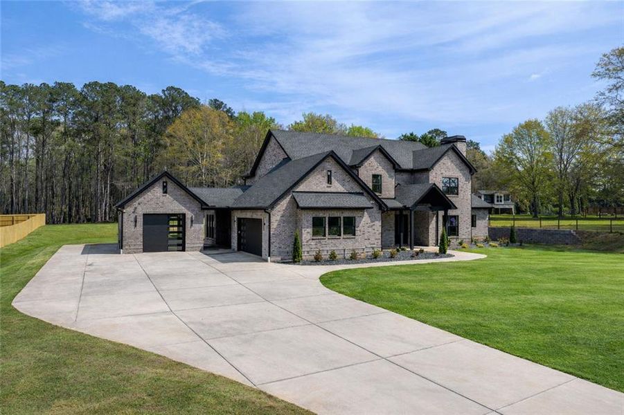 Front exterior of a new home in , Monroe, GA, highlighting curb appeal (Image 25). Front exterior of a new home in , Monroe, GA, highlighting curb appeal (Image 25).