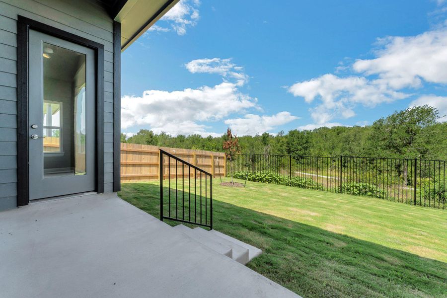 Fenced backyard with a patio Fenced backyard with a patio