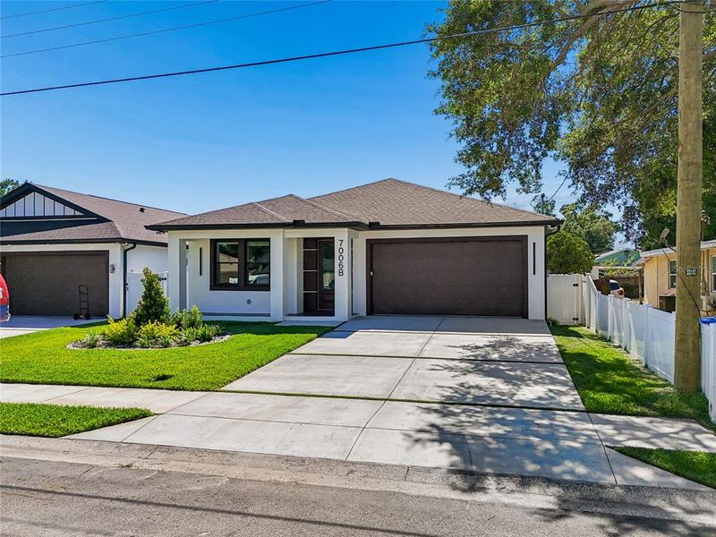 Front exterior of a new home in , Tampa, FL, highlighting curb appeal (Image 32).