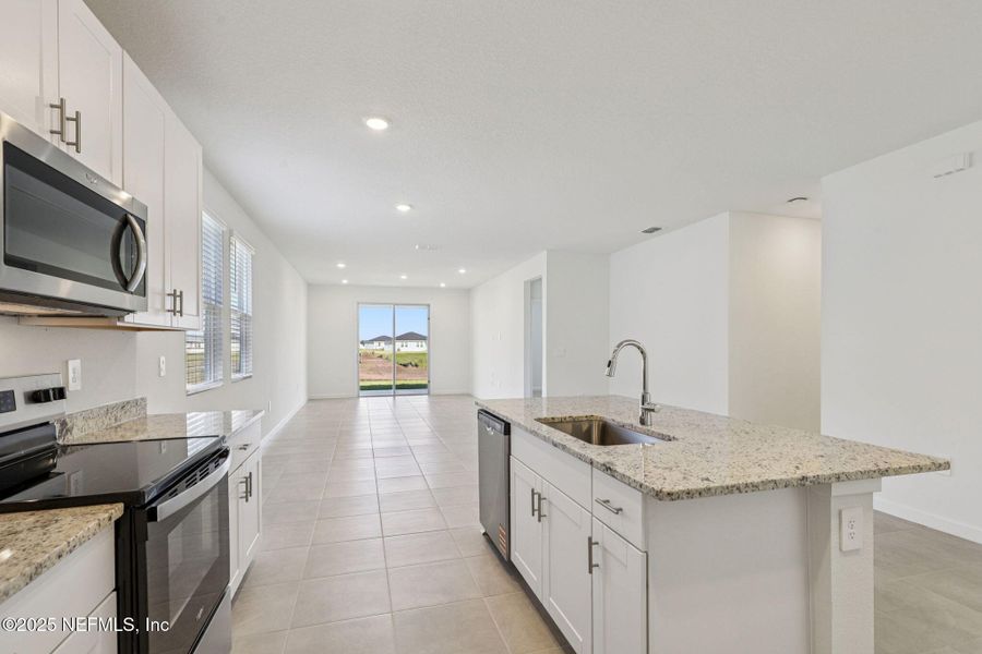 Furnished interior view inside a new home in Lakes at Bella Lago - Signature Series, Green Cove Springs (Image 7). Furnished interior view inside a new home in Lakes at Bella Lago - Signature Series, Green Cove Springs (Image 7).