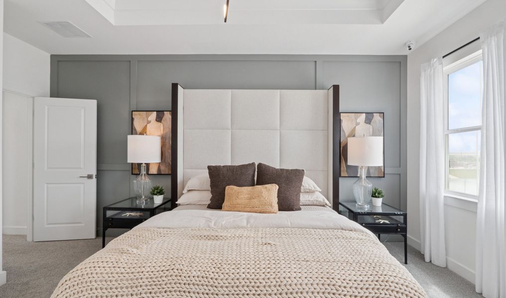 Primary suite with decorative feature wall Primary suite with decorative feature wall