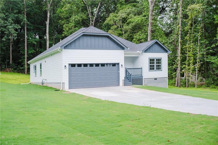 Front exterior of a new home in , Stockbridge, GA, highlighting curb appeal (Image 18).