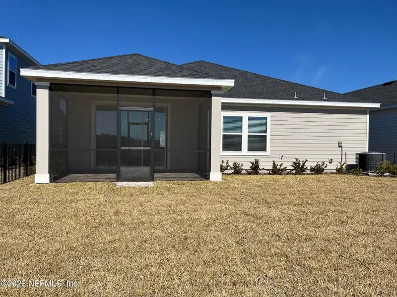 Exterior details and patio area of a home in Silver Falls Single Family at SilverLeaf, St. Augustine (Image 3).