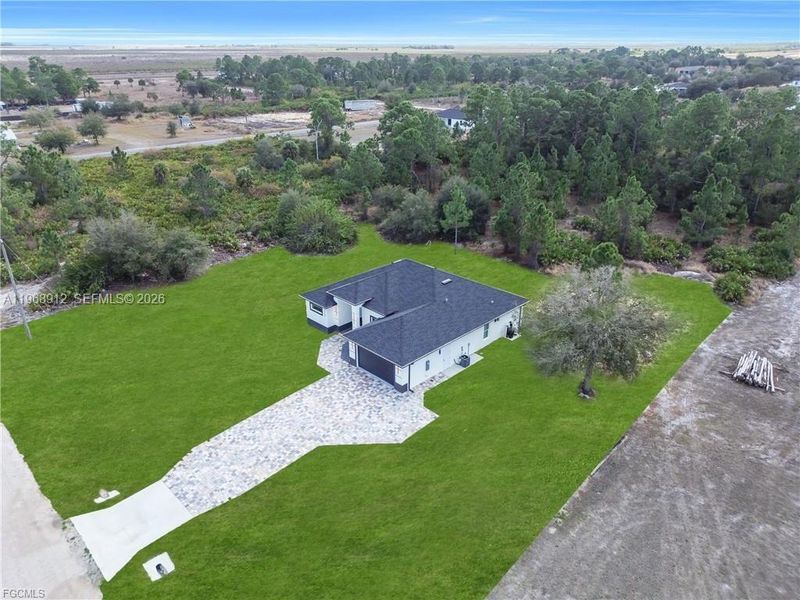 Front exterior of a new home in , Labelle, FL, highlighting curb appeal (Image 22).
