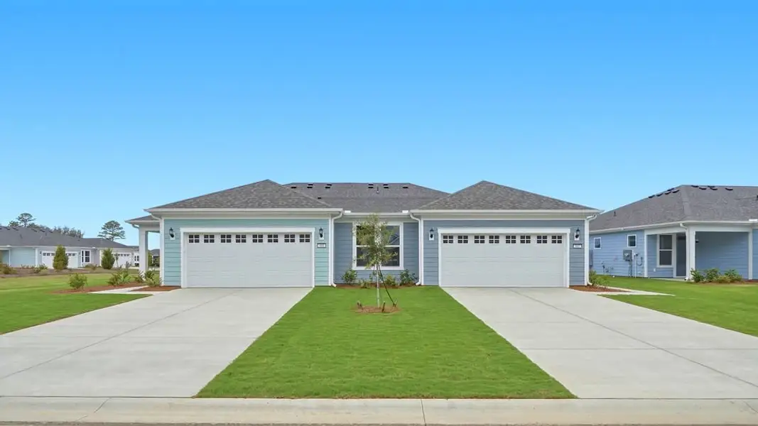 Front exterior of a new home in Sun City Hilton Head, Bluffton, SC, highlighting curb appeal (Image 23). Front exterior of a new home in Sun City Hilton Head, Bluffton, SC, highlighting curb appeal (Image 23).