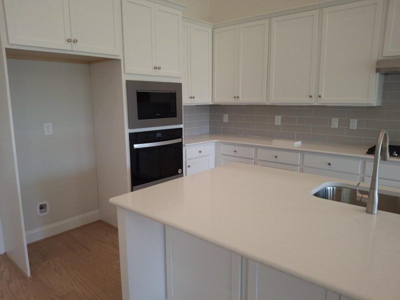 Furnished interior view inside a new home in Weybridge, Burlington (Image 6).