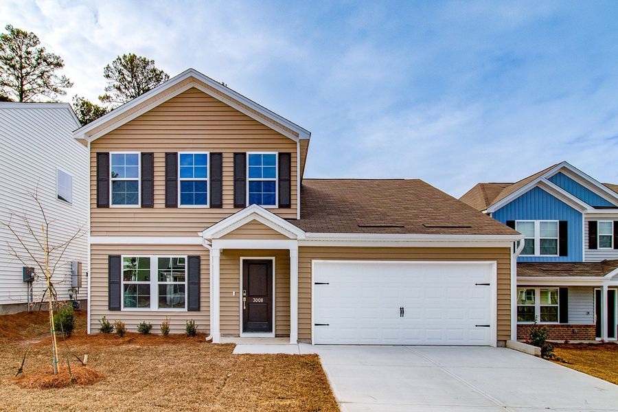 Front exterior of a new home in Ellington, Elgin, SC, highlighting curb appeal (Image 1). Front exterior of a new home in Ellington, Elgin, SC, highlighting curb appeal (Image 1).