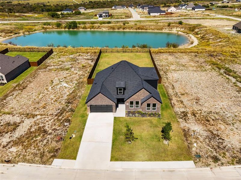 Front exterior of a new home in , Venus, TX, highlighting curb appeal (Image 21).