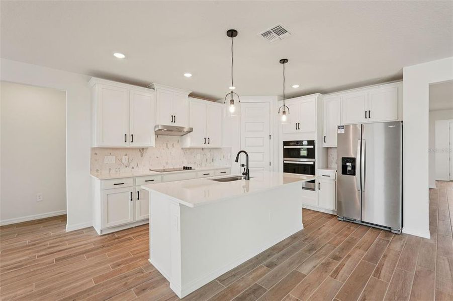 Furnished interior view inside a new home in Oakfield Trails - Signature Series, Parrish (Image 7).